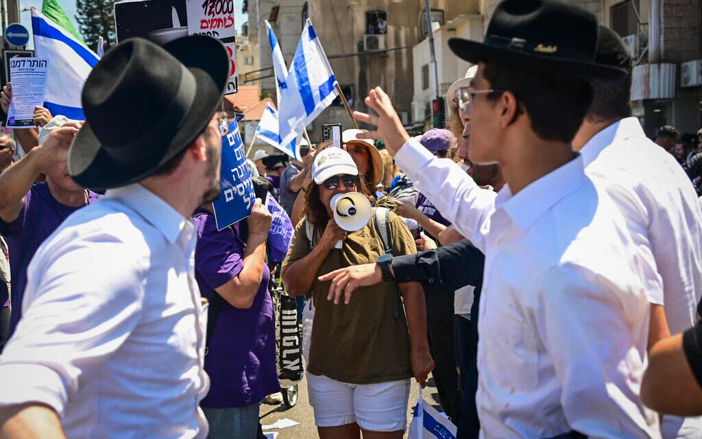 Dozens of protesters block road in Bnei Brak in demand for ultra